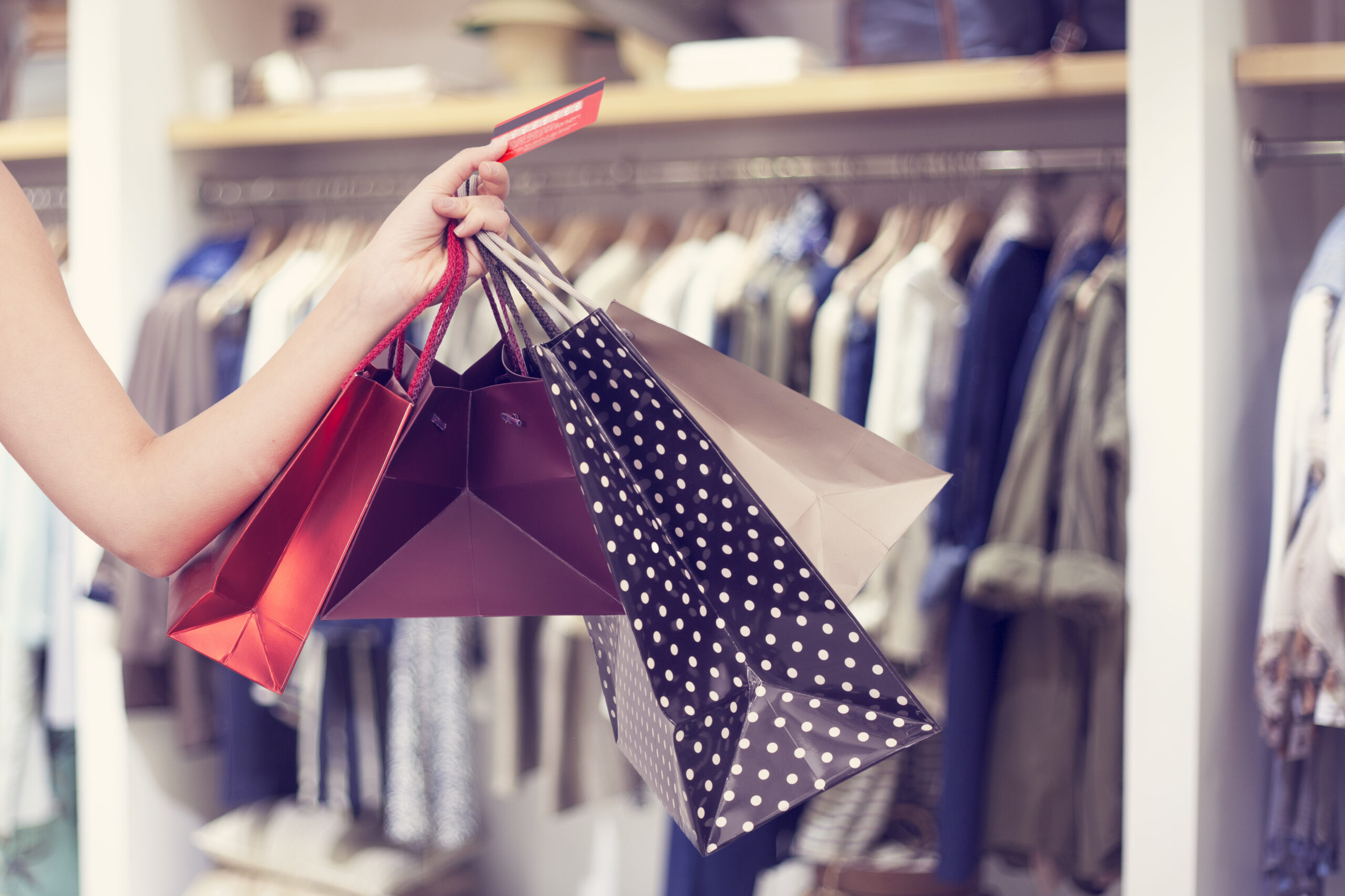 Person holding shopping bags