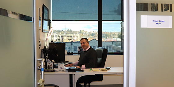 Travis in office