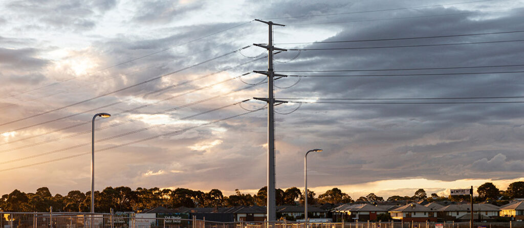 A utility pole with power lines stands tall