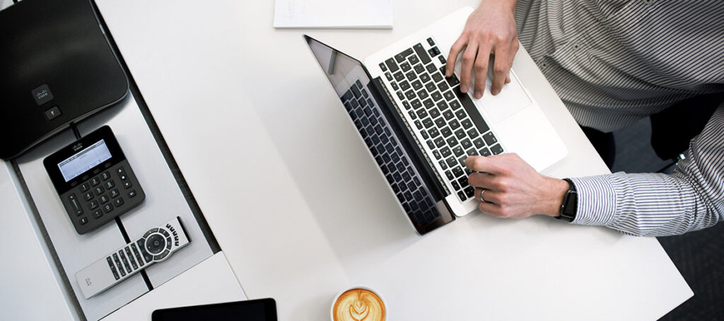 Man typing on laptop