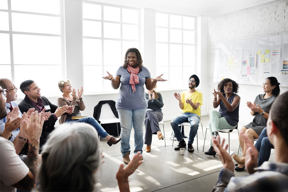 better_tomorrow_diversity Woman talking to group of people