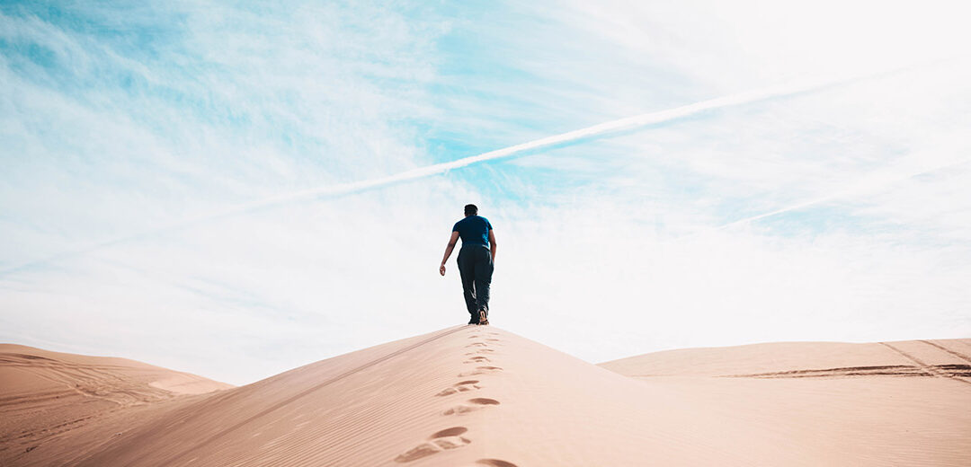 Man walks through desert