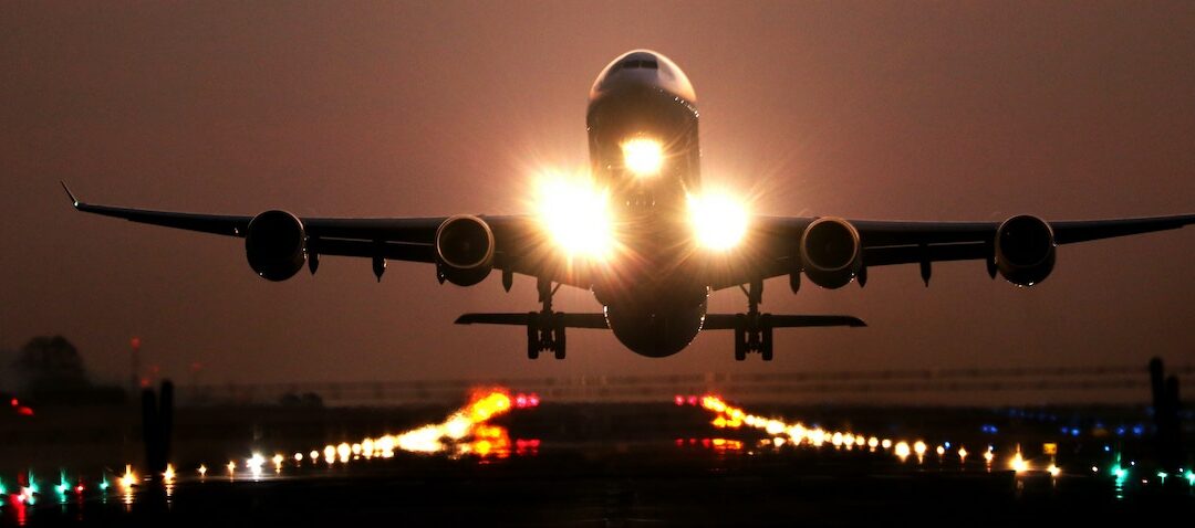 plane taking off at twilight