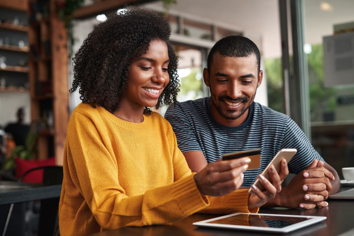 man and woman using utility customer portal on smartphone