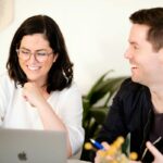 agile-bridging-customer-development-gap-banner female sales rep in meeting with client