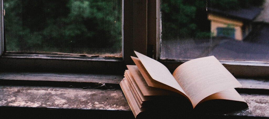 Book on window shelf