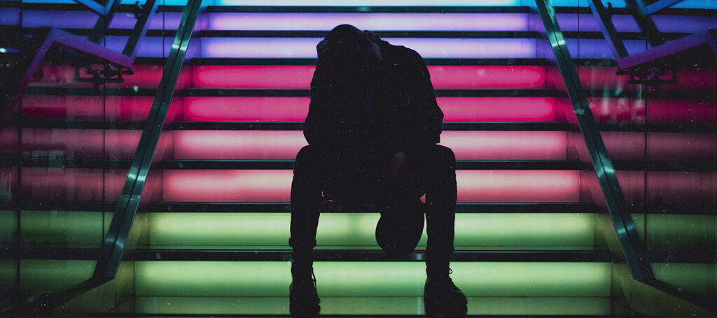 Person sits on steps